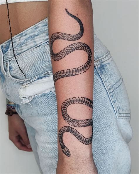 snake wrapped around arm tattoo|Snake wrapping around arm tattoo